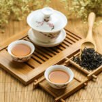 Herbal tea set on wooden tray.