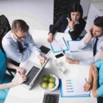 Healthcare professionals analyzing patient data and records through hospital management system