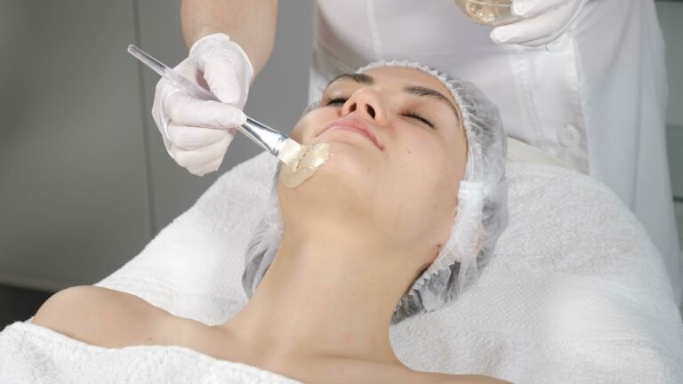 Woman receiving an anti-aging facial Reston VA with a soothing mask applied by an esthetician