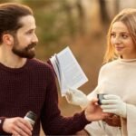 Couple holding coffee mugs and enjoying a meaningful conversation together